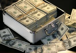 grey metal case of hundred dollar bills