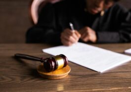 judge signing on the papers court gavel