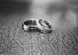 close up of wedding rings on floor
