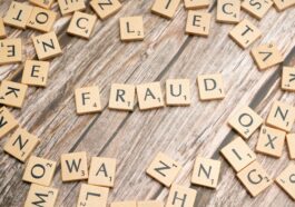 the word fraud spelled out in scrabble letters