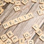 health scrabble letters on a wooden table