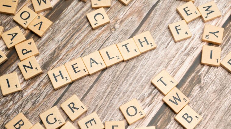 health scrabble letters on a wooden table